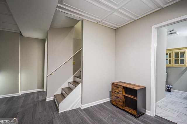 staircase with hardwood / wood-style floors