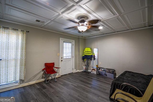 sitting room featuring dark hardwood / wood-style floors and ceiling fan