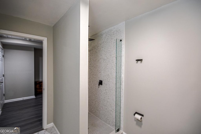 bathroom with a tile shower