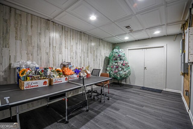 office featuring wood-type flooring and wood walls