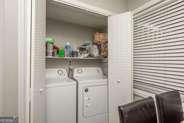 laundry room with independent washer and dryer