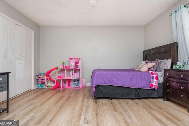 bedroom with a closet and light wood-type flooring