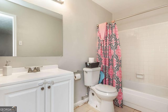 full bathroom with vanity, shower / tub combo with curtain, tile patterned floors, and toilet