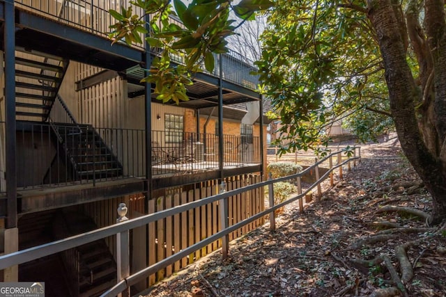 view of side of home featuring an outbuilding