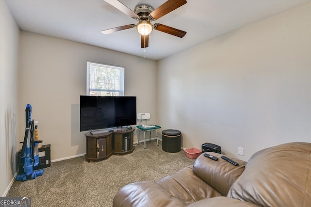 carpeted living room featuring ceiling fan