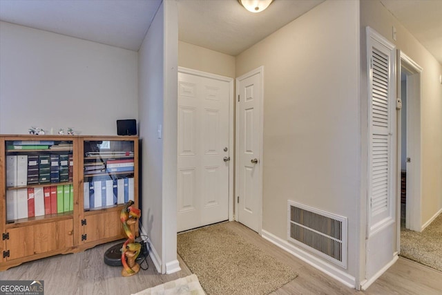 entryway with light hardwood / wood-style flooring