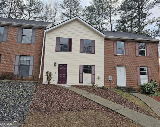 view of front of home with brick siding