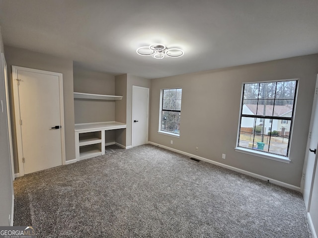 unfurnished bedroom with carpet floors