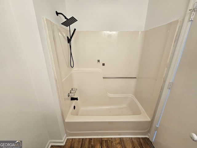 bathroom featuring wood finished floors and shower / bath combination