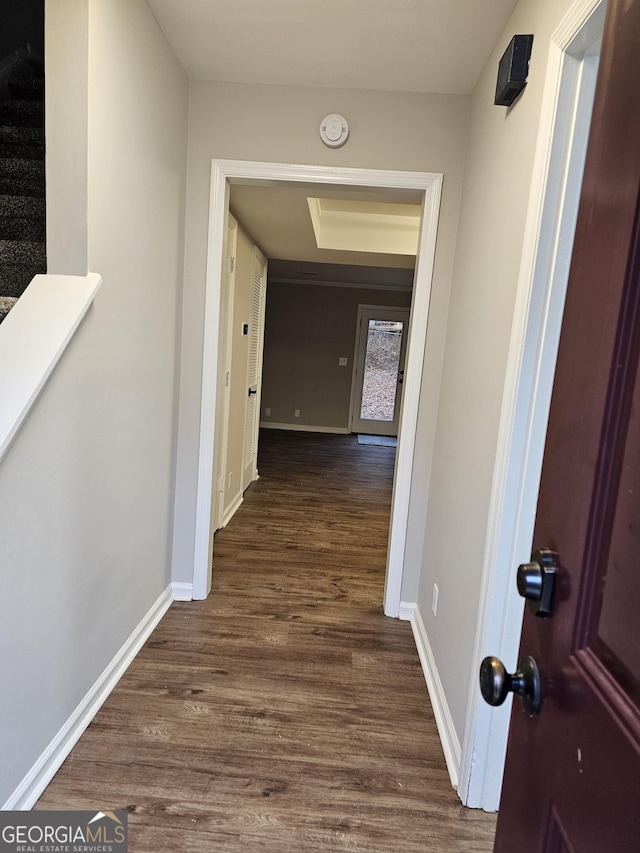 hall with dark wood-type flooring