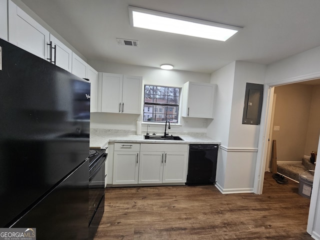 kitchen with white cabinetry, sink, black appliances, and electric panel