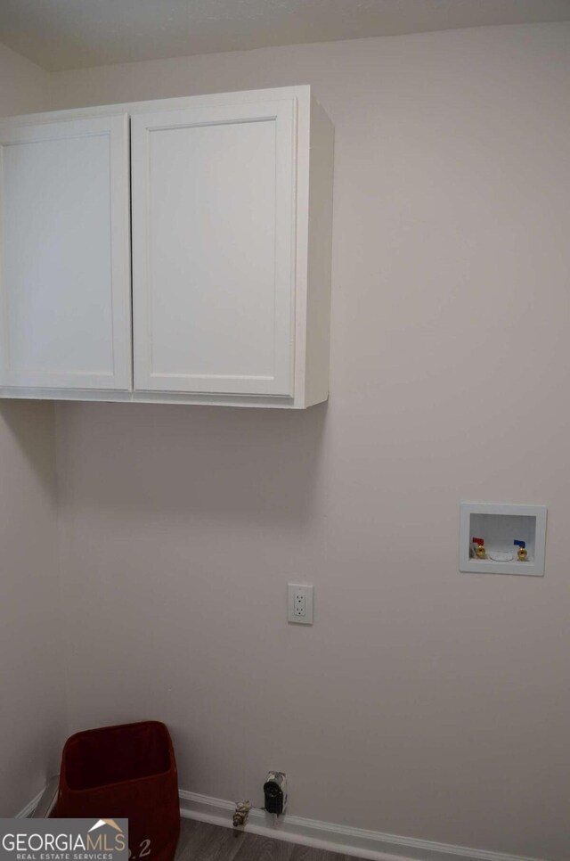 4447 Pharr Ave, Macon, GA 31204 - clothes washing area with cabinets, wood-type flooring, washer hookup, and gas dryer hookup