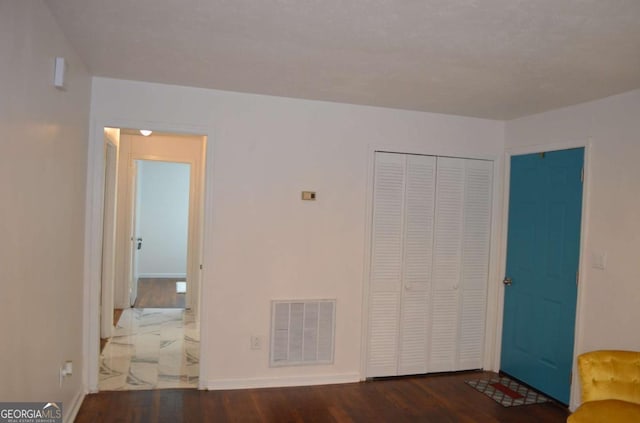 4447 Pharr Ave, Macon, GA 31204 - unfurnished bedroom featuring dark hardwood / wood-style floors and a closet