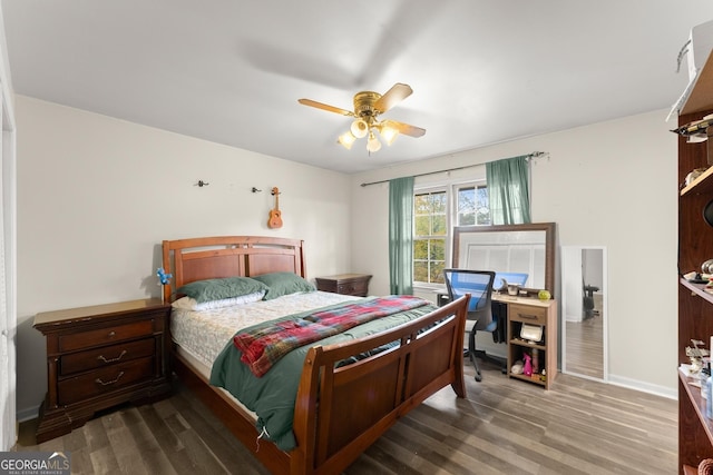 bedroom with wood-type flooring and ceiling fan