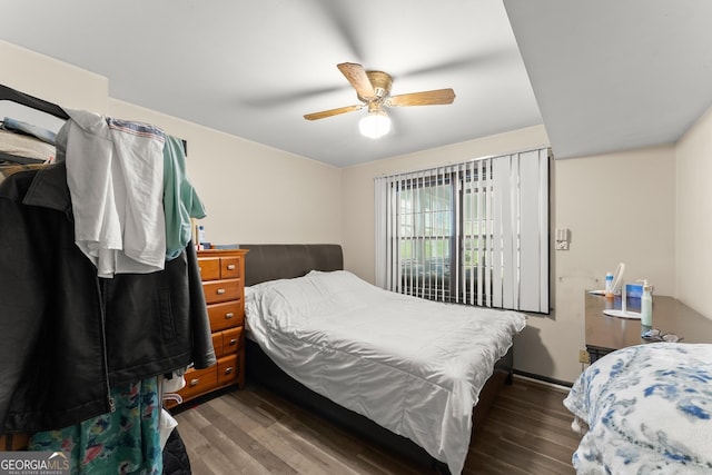 bedroom featuring dark wood-type flooring and ceiling fan