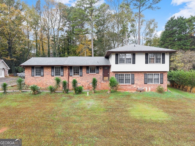 split level home with a front lawn