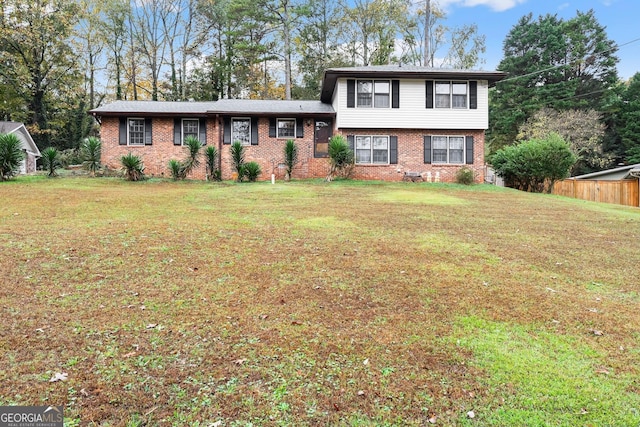 tri-level home featuring a front yard