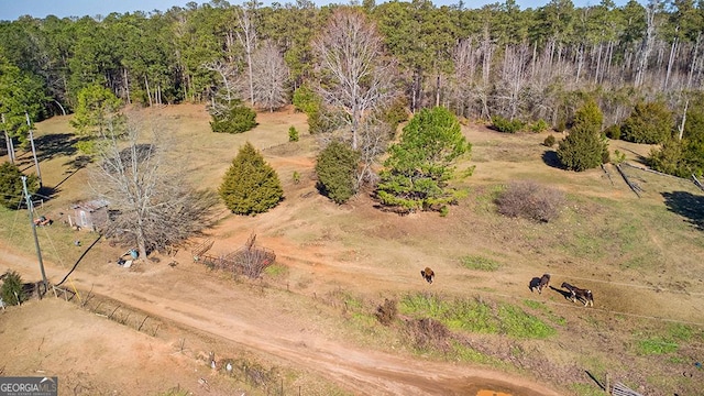 birds eye view of property featuring a rural view