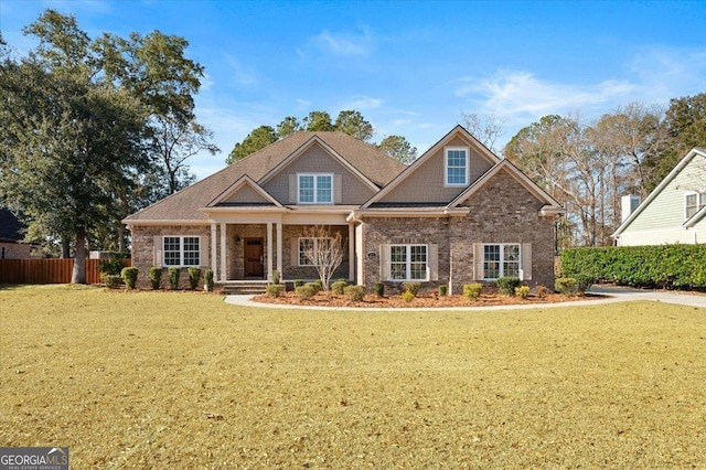 craftsman-style home with a front lawn