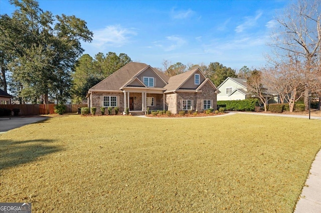 craftsman-style house featuring a front lawn