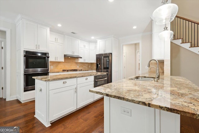 kitchen with stainless steel appliances, white cabinetry, and kitchen peninsula