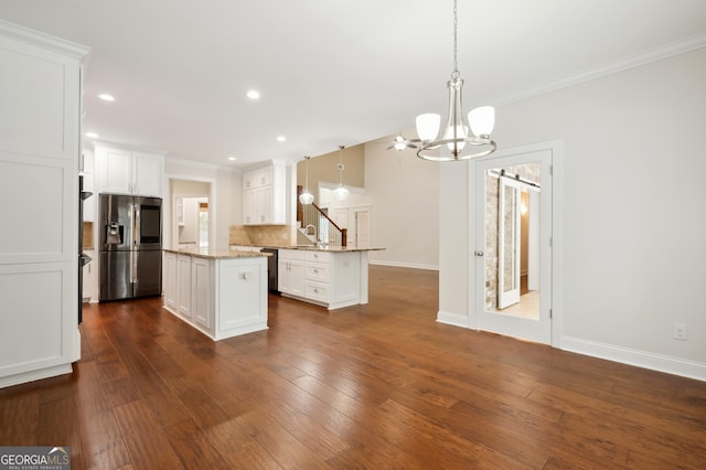 kitchen featuring pendant lighting, black dishwasher, stainless steel fridge with ice dispenser, and white cabinets