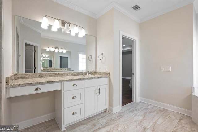 bathroom with vanity and crown molding