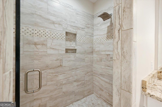 bathroom with a shower with shower door