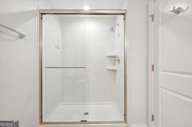 bathroom featuring an enclosed shower