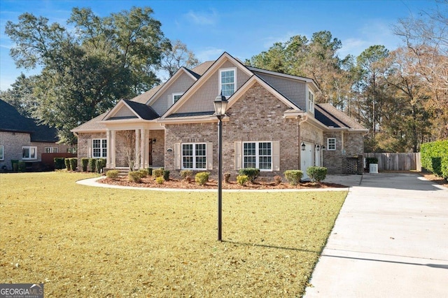 view of front facade with a garage and a front yard