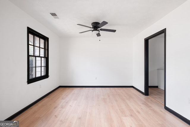 unfurnished room with ceiling fan and light hardwood / wood-style floors