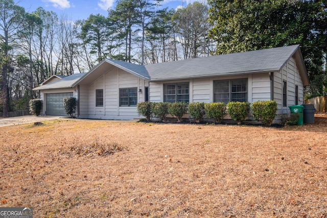 ranch-style house featuring a garage