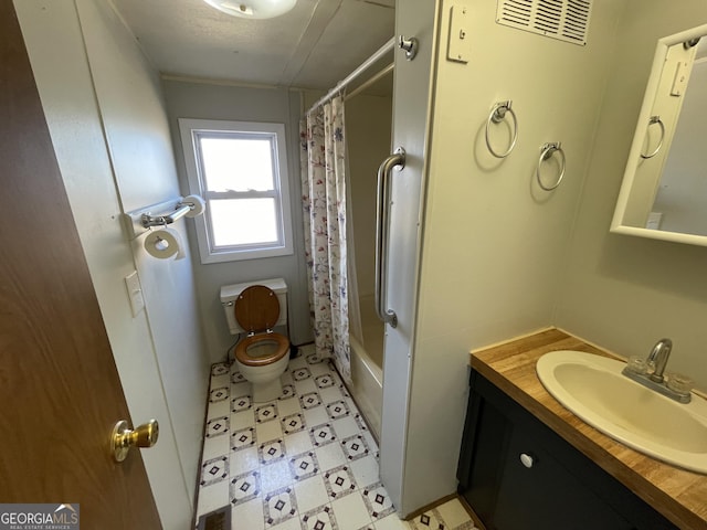 full bathroom with vanity, toilet, and shower / bath combo with shower curtain