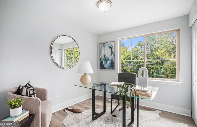 home office with light wood-type flooring