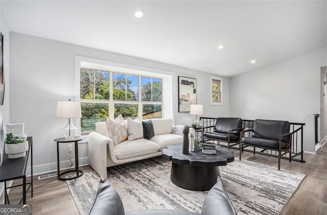 living room with light hardwood / wood-style flooring