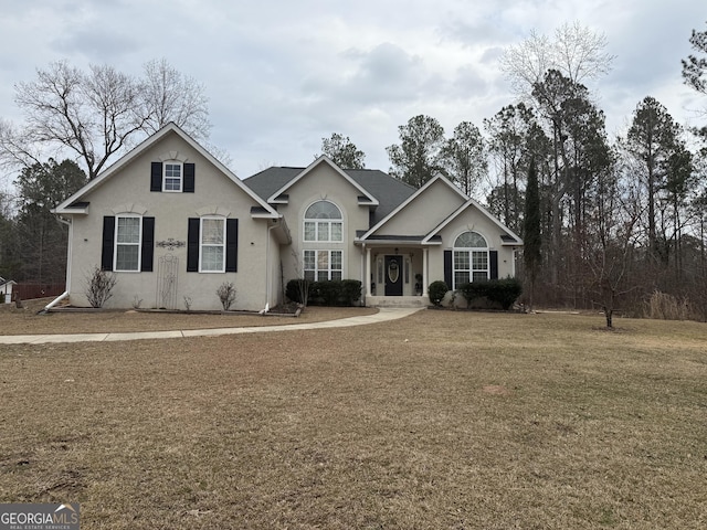 view of front of home with a front lawn