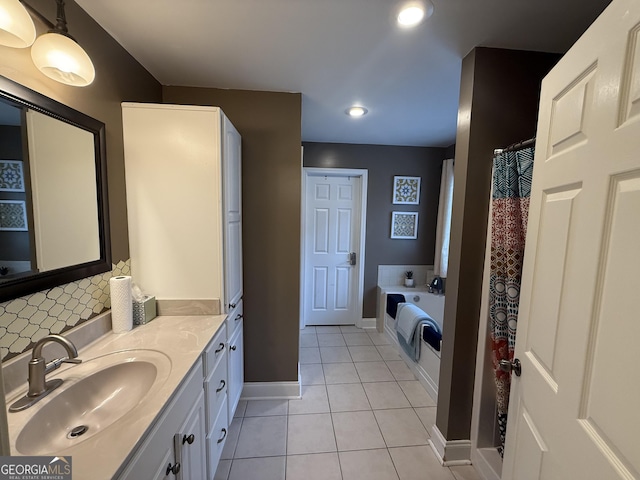 bathroom featuring vanity, tile patterned floors, and decorative backsplash