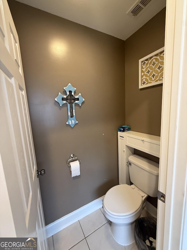 bathroom featuring tile patterned floors and toilet