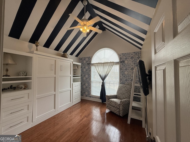 unfurnished room with ceiling fan, dark hardwood / wood-style floors, and high vaulted ceiling