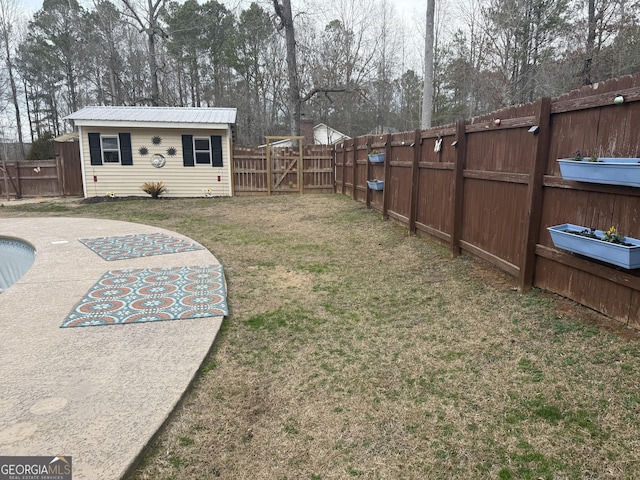 view of yard featuring an outbuilding and a patio