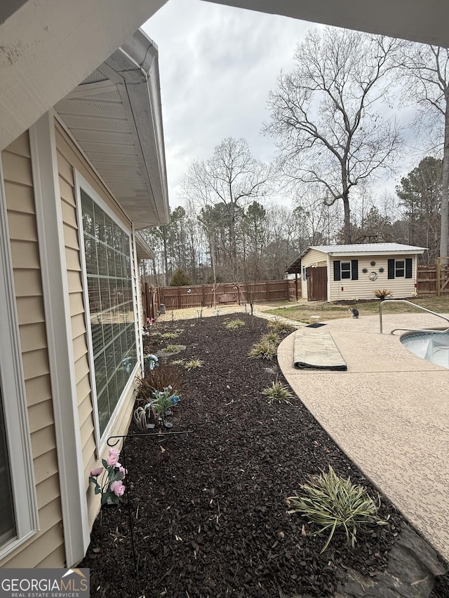 view of yard with an outbuilding and a patio area