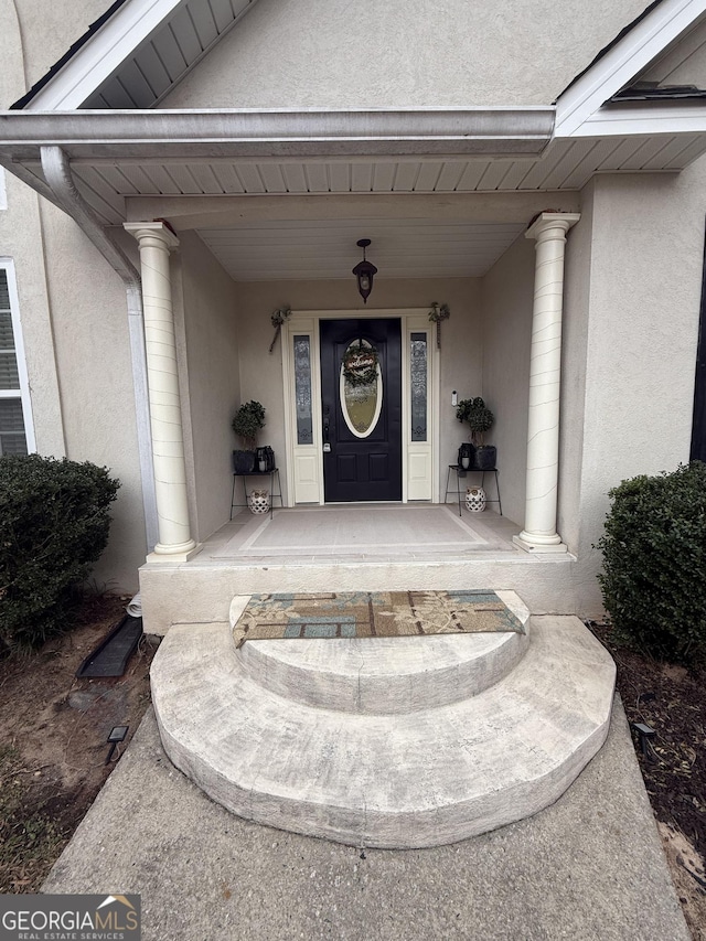 doorway to property featuring a porch