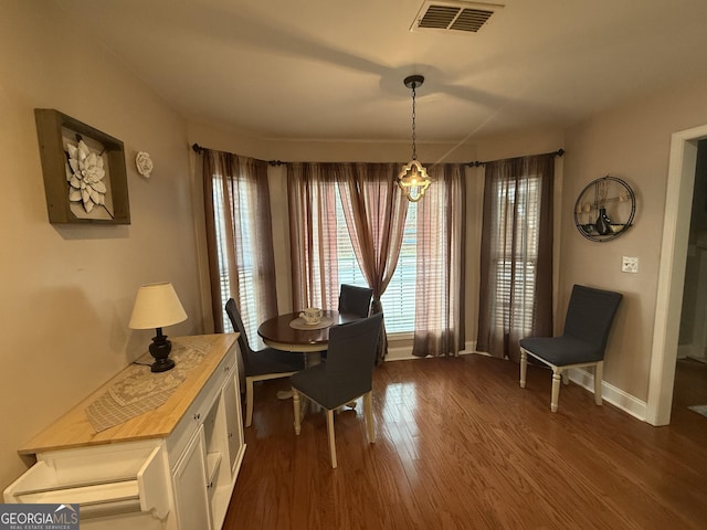 sitting room with dark wood-type flooring