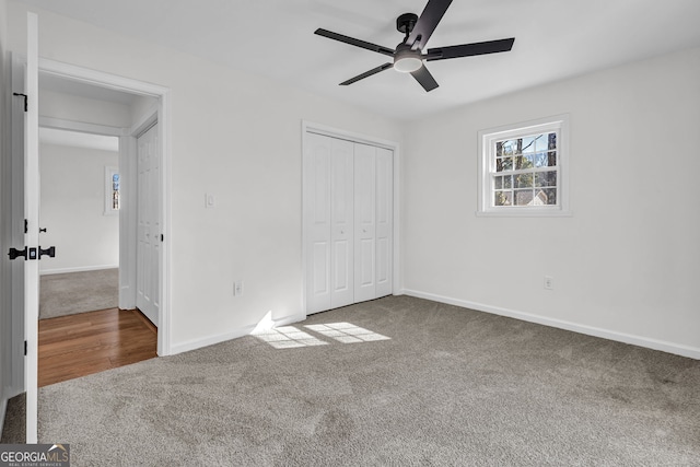 unfurnished bedroom featuring carpet, ceiling fan, and a closet