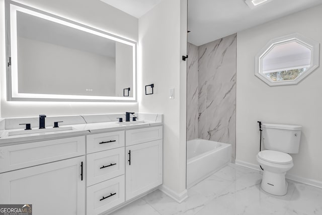 full bathroom featuring tiled shower / bath combo, vanity, and toilet