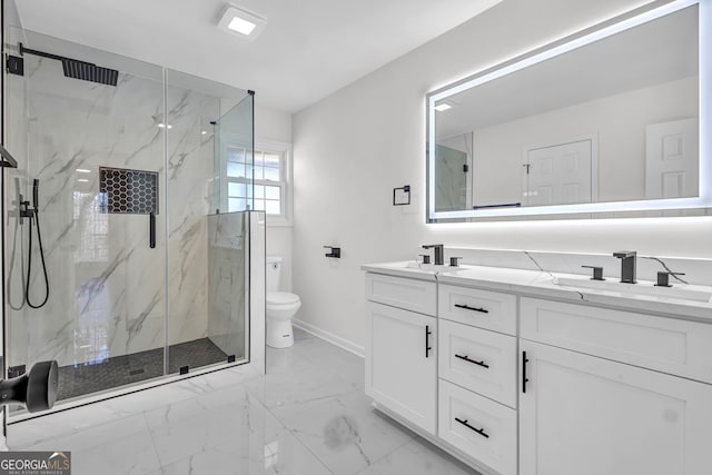 bathroom featuring vanity, toilet, and a shower with shower door