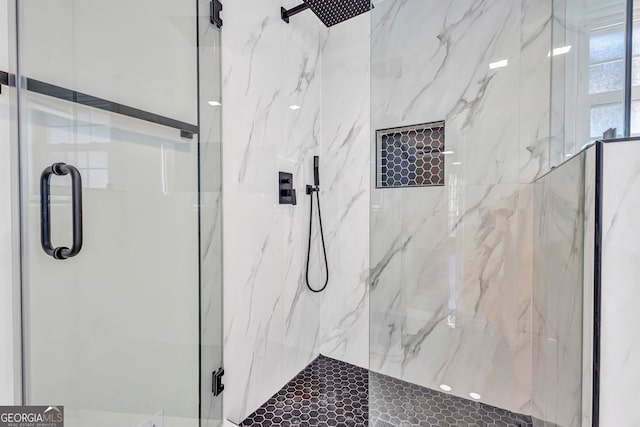 bathroom with a shower with shower door