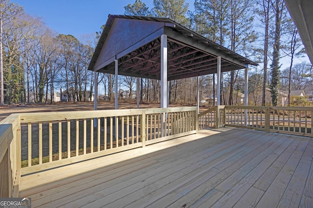 wooden terrace featuring a gazebo