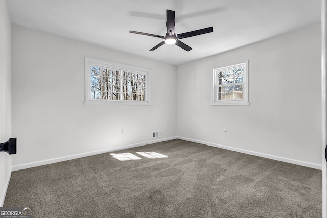 carpeted empty room with ceiling fan