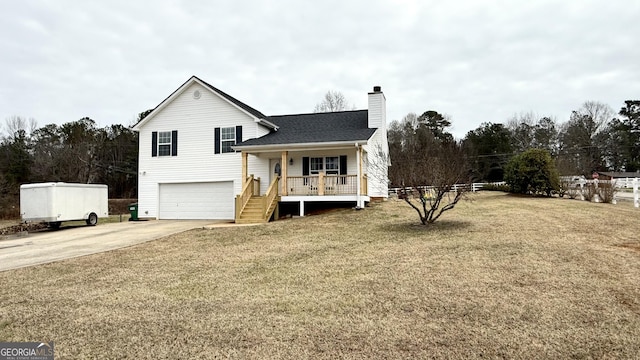 split level home featuring a garage, a front yard, and a porch